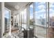 Bright office space with floor to ceiling windows offering cityscape views and glass desk at 130 26Th Nw St # 807, Atlanta, GA 30309