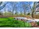 Expansive backyard featuring lush green grass and a cozy fire pit area, ideal for relaxing and enjoying the outdoors at 1604 Temple Ave, Atlanta, GA 30337