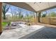 A backyard patio featuring outdoor furniture and manicured landscaping at 1604 Temple Ave, Atlanta, GA 30337