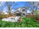 Landscaped backyard with a built-in seating area and a well-maintained lawn, perfect for outdoor entertaining at 1604 Temple Ave, Atlanta, GA 30337