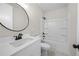 Bathroom featuring a vanity with modern fixtures and a shower-tub combination at 1604 Temple Ave, Atlanta, GA 30337