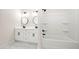 Bathroom featuring a double vanity with modern fixtures and a shower-tub combination at 1604 Temple Ave, Atlanta, GA 30337