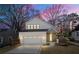 Charming two-story home with a brick facade and a well-manicured front yard, offering curb appeal and a welcoming entrance at 1604 Temple Ave, Atlanta, GA 30337
