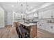 Well-lit kitchen featuring a center island, stainless steel appliances, and plenty of cabinet space at 1604 Temple Ave, Atlanta, GA 30337