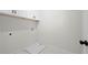 A bright laundry room with white cabinets at 1604 Temple Ave, Atlanta, GA 30337