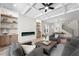Comfortable living room featuring a modern fireplace, built-in shelving, and wood floors at 1604 Temple Ave, Atlanta, GA 30337