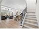 Bright living room area with fireplace, beamed ceilings and an open concept dining area at 1604 Temple Ave, Atlanta, GA 30337