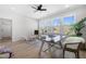 Office room with hardwood floors, ceiling fan, and large windows overlooking trees at 1604 Temple Ave, Atlanta, GA 30337