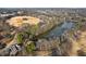 Aerial view of a park with a serene lake, lush trees, and open fields at 206 11Th Ne St # 205, Atlanta, GA 30309