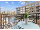 Inviting balcony featuring a table, chairs, and views of the city and nearby buildings at 206 11Th Ne St # 205, Atlanta, GA 30309