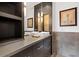 Modern bathroom features a double sink vanity, gray tile and minimalist lighting at 206 11Th Ne St # 205, Atlanta, GA 30309