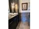 Modern bathroom features a double sink vanity, gray tile and minimalist lighting at 206 11Th Ne St # 205, Atlanta, GA 30309