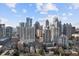 Wide cityscape view shows high-rise apartments and office buildings in Atlanta on a sunny day at 206 11Th Ne St # 205, Atlanta, GA 30309