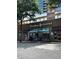 A Caribou Coffee shop with outdoor seating and large windows offering a cozy and inviting atmosphere at 206 11Th Ne St # 205, Atlanta, GA 30309