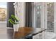 Bright dining area with a wood table, chairs, and balcony access, perfect for enjoying meals with a view at 206 11Th Ne St # 205, Atlanta, GA 30309