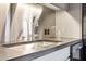 Modern kitchen features a stainless steel sink and countertop with sleek faucet and fixtures at 206 11Th Ne St # 205, Atlanta, GA 30309