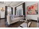 Bright living room with a comfortable sofa, modern art, and large windows, creating a welcoming space at 206 11Th Ne St # 205, Atlanta, GA 30309