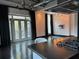 This room is has a dark wood floor, gas cooktop, modern lighting, and sliding glass doors to balcony at 206 11Th Ne St # 205, Atlanta, GA 30309