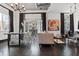 Open living room with a dining area and balcony access, offering a seamless indoor-outdoor living experience at 206 11Th Ne St # 205, Atlanta, GA 30309