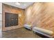 Well-maintained mailroom area with stylish wood walls and comfortable seating at 206 11Th Ne St # 205, Atlanta, GA 30309
