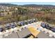 Aerial view of the neighborhood and surrounding wooded landscape at 2910 Bishopstone Way, Cumming, GA 30040