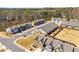 Ariel view of the community showcasing well-manicured lawns and a street view at 2910 Bishopstone Way, Cumming, GA 30040