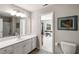 Bathroom with a large vanity and a combined tub and shower at 2910 Bishopstone Way, Cumming, GA 30040