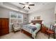 Comfortable bedroom with natural light, a ceiling fan, and neutral décor at 2910 Bishopstone Way, Cumming, GA 30040