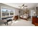 Bedroom with a four-poster bed and a view of the neighborhood at 2910 Bishopstone Way, Cumming, GA 30040