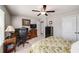 This bedroom features a ceiling fan, a workstation, and a double-door closet at 2910 Bishopstone Way, Cumming, GA 30040