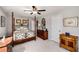 Bedroom showcasing a wrought iron bed frame, dark furniture, and warm decor at 2910 Bishopstone Way, Cumming, GA 30040