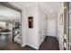 Bright entryway with hardwood floors, multiple closets, leading to a spacious living area with stairs at 2910 Bishopstone Way, Cumming, GA 30040