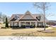 Charming home exterior featuring manicured lawn and inviting entrance at 2910 Bishopstone Way, Cumming, GA 30040