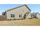 Traditional home exterior with green lawn and mature landscaping at 2910 Bishopstone Way, Cumming, GA 30040