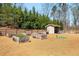 Community garden with raised beds, water, and a small shed in a fenced area at 2910 Bishopstone Way, Cumming, GA 30040