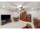 Spacious living room featuring bright lighting, neutral carpeting and built-in bookcases at 2910 Bishopstone Way, Cumming, GA 30040