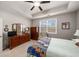 Bright main bedroom filled with natural light, complemented by a wooden dresser and comfortable furnishings at 2910 Bishopstone Way, Cumming, GA 30040