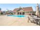 Community pool with lounge chairs, umbrellas, and a well-maintained patio at 2910 Bishopstone Way, Cumming, GA 30040