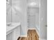 Well-lit bathroom featuring a shower-tub combo and wood look floors at 4571 Parkway Cir, Atlanta, GA 30349