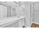 Bright bathroom featuring large mirror, ample counter space, and neutral color palette at 4571 Parkway Cir, Atlanta, GA 30349
