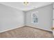 Cozy bedroom featuring plush carpeting and natural light from a window at 4571 Parkway Cir, Atlanta, GA 30349