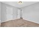 Bedroom showcasing plush carpeting, neutral paint, and ample closet space at 4571 Parkway Cir, Atlanta, GA 30349
