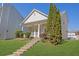 Inviting home featuring a well-kept lawn and a quaint front porch at 4571 Parkway Cir, Atlanta, GA 30349