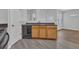 Kitchen features wood cabinets, black appliances, and a view into the adjacent living area at 4571 Parkway Cir, Atlanta, GA 30349