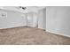 Spacious bedroom featuring neutral color scheme, tray ceiling with fan, and plush carpeting at 4571 Parkway Cir, Atlanta, GA 30349