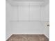 Walk-in closet equipped with shelving for ample storage, and neutral carpeting at 4571 Parkway Cir, Atlanta, GA 30349