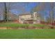 Spacious backyard featuring a deck with stairs and lush grass at 617 Creekstone Ct, Jonesboro, GA 30236