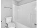 Bathroom featuring a tiled bathtub and shower at 617 Creekstone Ct, Jonesboro, GA 30236