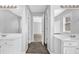 Bright bathroom featuring double vanity, large mirrors, and neutral color palette creating a modern and clean aesthetic at 617 Creekstone Ct, Jonesboro, GA 30236