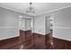 Spacious dining room features hardwood floors and opens to other living spaces at 617 Creekstone Ct, Jonesboro, GA 30236